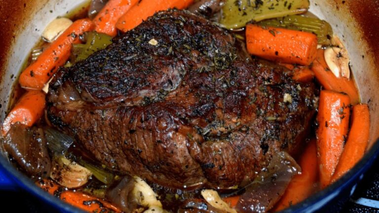 ATTACHMENT DETAILS Close-up of tender beef pot roast with colorful vegetables in Ninja Foodi