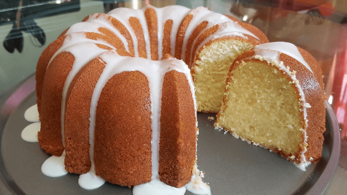 Vintage pound cake on a rustic table setting, illustrating the timeless appeal and rich history of this classic dessert